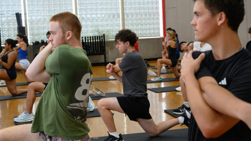 Students stretching on yoga mats