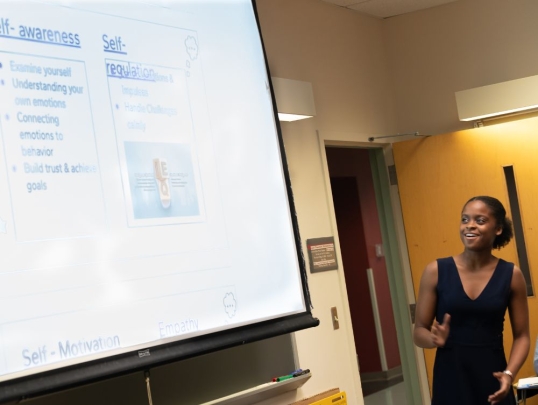 Student presenting in front of classmates