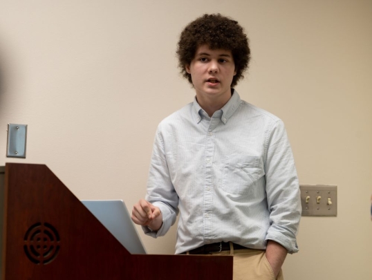 Student presenting in front of classmates