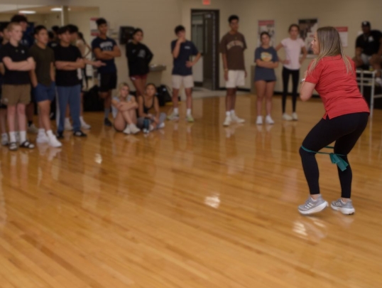 Instructor showing physical therapy exercises