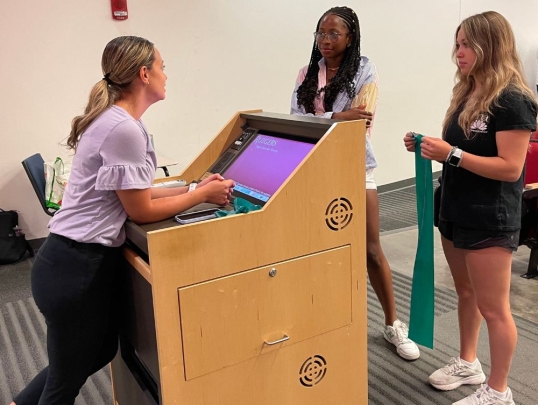 Students talking to their instructor
