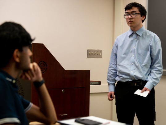 Student presenting in front of classmates