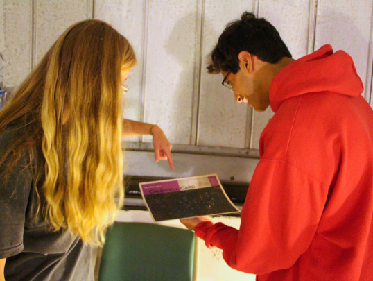 Student in Astronomy Observatory looking at an image