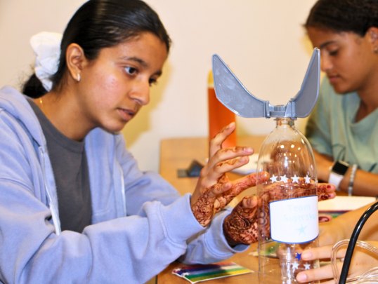 Student building a water bottle rocket