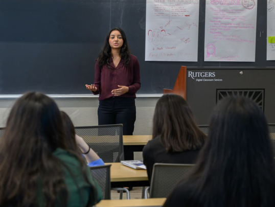 Student presenting in front of classmates