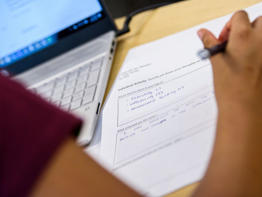 Student writing on their schoolwork