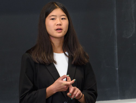 Student presenting in front of classmates