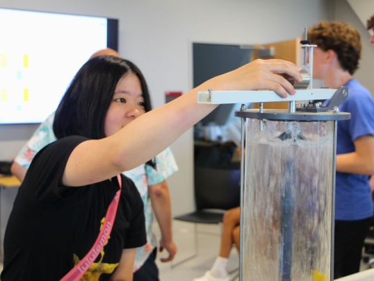 Student using engineering water experiment