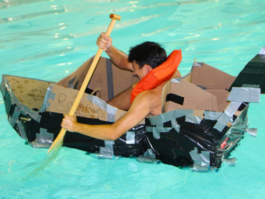 Student competing in the boat races