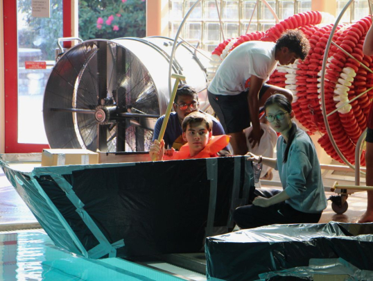 Students competing in the boat races