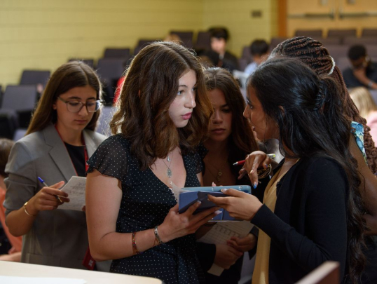 Students conferring on mock trial case