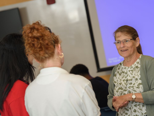 Students speaking with an instructor
