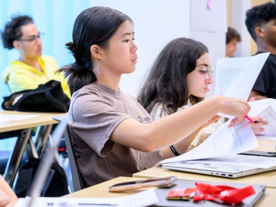Student looking at class materials