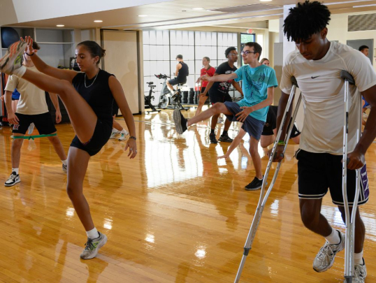 Students practicing physical therapy exercises